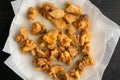 Close-Up of Fried Pieces of Chicken Draining on Paper Towels Royalty Free Stock Photo