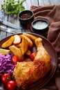 Close-up of fried potatoes, chicken, salad