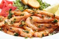 Close up of fried shrimps and salad in olive oil