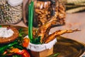 Close up of fried small fish with healthy fresh salad