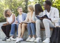 Close up of friendly group of students studying outdoors Royalty Free Stock Photo