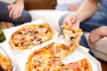 Close up of friends with beer and pizza at home Royalty Free Stock Photo