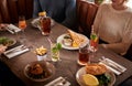 Close Up Of Friends Meeting For Meal In Traditional English Pub Royalty Free Stock Photo