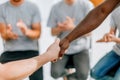 close up. friends the participants of the workshop, shaking hands with each other Royalty Free Stock Photo