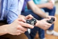 Close up of friends playing video games at home Royalty Free Stock Photo