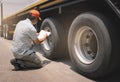 Close-up, Front a big truck wheel, tire of semi truck parked at sunset sky. Industry freight truck transportation Royalty Free Stock Photo