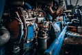 Close-up of the front end of a blue antique steam engine Royalty Free Stock Photo