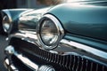 a close up of the front end of a classic car