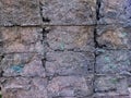 a close-up, front-facing view of a weathered stone or masonry wall. Royalty Free Stock Photo