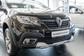 Close-up of front and hood of Dark gray Renault Sandero Stepway car in showroom of Renault dealership. Left side view. Renault Royalty Free Stock Photo