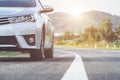 Close up front of new silver car parking on the asphalt road Royalty Free Stock Photo