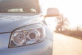 front new silver SUV car. Detail of a modern car. Head light Royalty Free Stock Photo