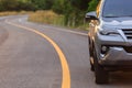 Close up front of new silver SUV car parking on the asphalt road Royalty Free Stock Photo