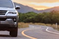 Close up front of new silver SUV car parking on the asphalt road Royalty Free Stock Photo