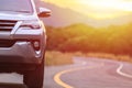 Close up front of new silver SUV car parking on the asphalt road Royalty Free Stock Photo