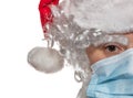 Close up front shot of Santa Claus wearing a medical mask. New normal, new reality concept. Winter holidays with Covid 19 concept