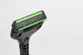 Close up, Front side of triple blade with double lubricant strip shaver or razor for shaving