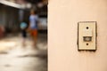 close up and front view of bell or buzzer is on the plaster wall in entry front of the house for security and safety to the Royalty Free Stock Photo