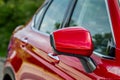 Close up front view of car side mirror. Front rear view mirror on the car window. Royalty Free Stock Photo