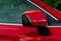 Close up front view of car side mirror. Front rear view mirror on the car window. Royalty Free Stock Photo