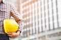 Close up front view of engineering male construction worker stand holding safety Royalty Free Stock Photo