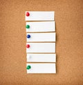 Close up front view of illustrative corkboard with blank white n