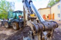 Close up front view on a mechanism or gear of cylinder actuator of digger bucket of excavator. The modern excavator