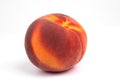 Close-up front view on one isolated colorful ripe fruit peach Royalty Free Stock Photo