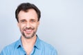 Close up front view portrait of mature cheerful excited satisfied glad virile masculine man wearing jeans denim shirt isolated on Royalty Free Stock Photo