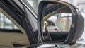 Close-up front view of rearview mirror and modern car interior. A rear view mirror on a car door. Royalty Free Stock Photo