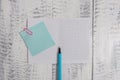 Close up front view squared open notebook sticky note clip highlighter lying wooden retro vintage rustic old background Royalty Free Stock Photo