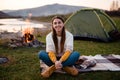 Camping on green meadow on river and mountain background Royalty Free Stock Photo