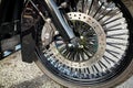 Close-up front wheel and fork of a classic beautiful motorcycle