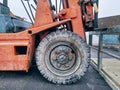 Close-up Front Wheel of Old Forklift Truck Royalty Free Stock Photo