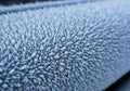 Close-up of a frosted surface covered in delicate ice crystals. The crystals are Royalty Free Stock Photo