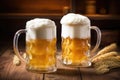 close-up of frothy beer in glass tankards on wooden table Royalty Free Stock Photo