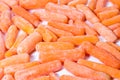 Close up of frozen baby carrots on white background Royalty Free Stock Photo