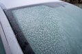 Close up of frozen car front windshield in winter Royalty Free Stock Photo
