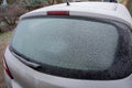 Close up of frozen car rear windshield in winter Royalty Free Stock Photo