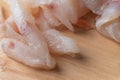 Frozen pangasius dory on wooden plate