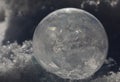 Close-up of Frozen Soap Bubble with Ice Crystals in Snow Royalty Free Stock Photo