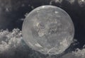 Close-up of Frozen Soap Bubble with Ice Crystals in Snow Royalty Free Stock Photo