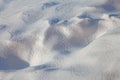 Close up of frozen white snow. Winter background. Snowy texture.