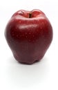 Close-up of fruit, fresh ripe uncooked flavorful sweet red apple isolated on a white background Royalty Free Stock Photo