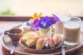 Close-up of fruits set and soybean milk in a glass placed on a wooden table. Snack set for after breakfast. Concept of foods