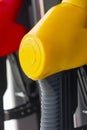 Close-up fuel nozzles on petrol and diesel fuel. Gas station pump. Man refueling gasoline with fuel in a car, holding a nozzle. Royalty Free Stock Photo