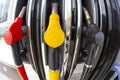 Close-up fuel nozzles on petrol and diesel fuel. Gas station pump. Man refueling gasoline with fuel in a car, holding a nozzle. Royalty Free Stock Photo