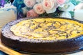 Close up full big pound of brownie cheese cake on wood plate dec