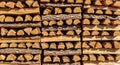 Stacked Firewood Pile with Rough Bark and Cut Wood Grain Texture logs Royalty Free Stock Photo