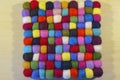 Multi coloured felt bobble table mat Royalty Free Stock Photo